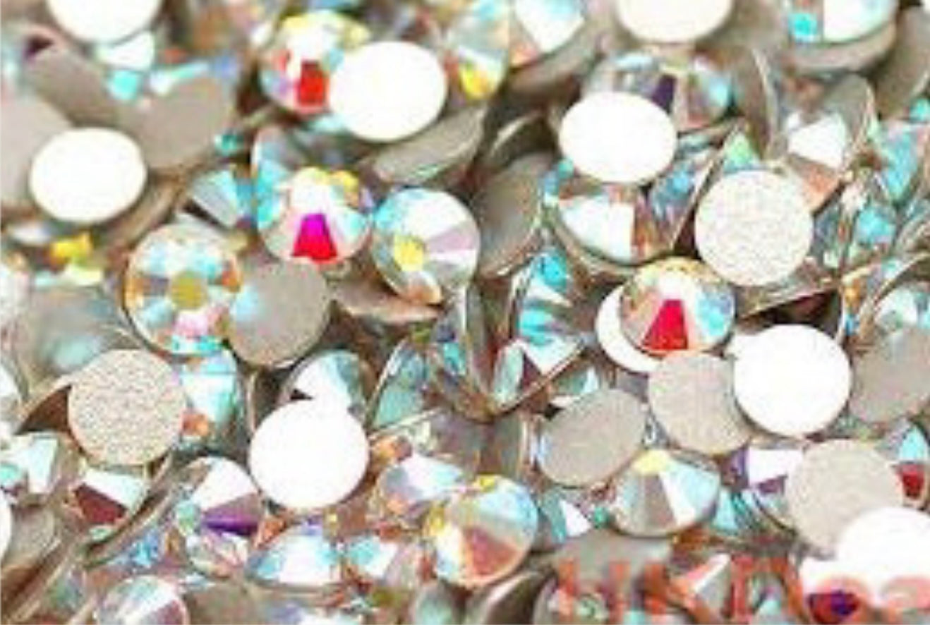 Preciosa maxima rhinestones  1 gross or 144 peices . The price includes labor to apply them as well.